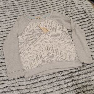 Light gray w/ sparkly silver design Rewind sweater